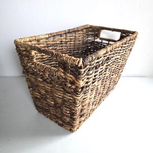 May include: A set of three ceramic mugs with a speckled, matte finish. Each mug features a different color: light blue, cream, and gray. The mugs have a simple, modern design and a comfortable handle.