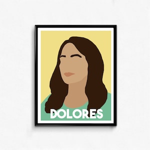 May include: A digital illustration of a woman with brown hair and a light green shirt. The text "DOLORES" is printed in white on the shirt.