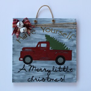 Rustic Christmas sign “have yourself a merry little Christmas” with a vintage truck