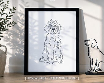 May include: A black and white line art print of a fluffy dog sitting, displayed in a black frame. The text ScenicRoute SHOP is at the top, and PHYSICAL PRINT - FRAME NOT INCLUDED is at the bottom. A separate dog wire sculpture sits nearby.