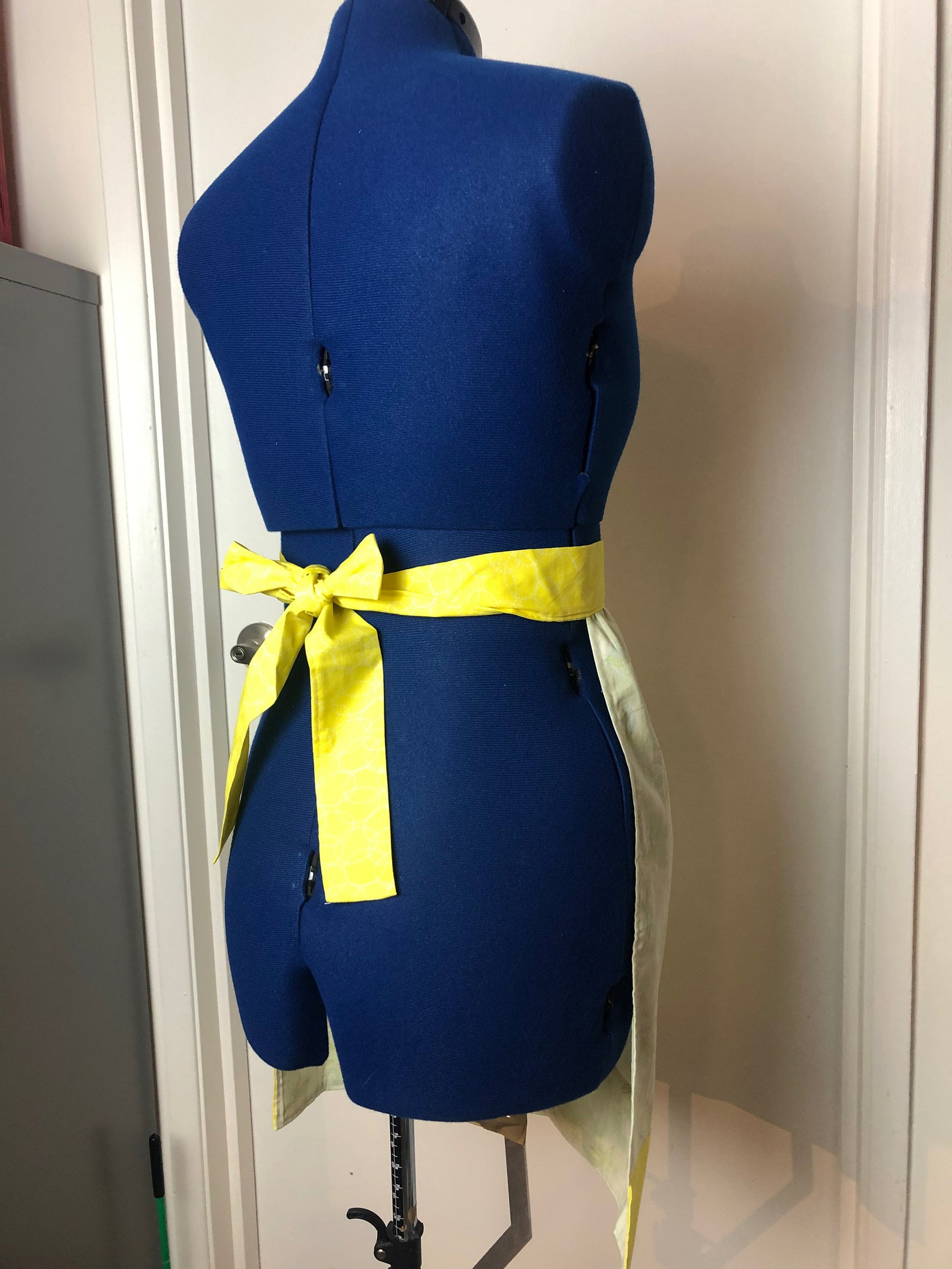 Apron-Dark Yellow background with light green and gold Motif