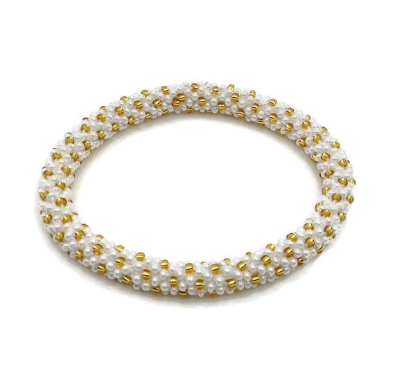Lifted Hope Nepal Beaded Bracelets Handmade by Ramila. Gold Dots on White Bracelet. Etsy