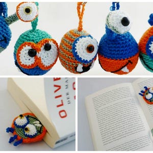 May include: Handmade crochet monster ornaments and bookmarks in a variety of colours. The ornaments feature large, expressive eyes and whimsical details, with blue, orange, green, and white. One bookmark is placed in a book.