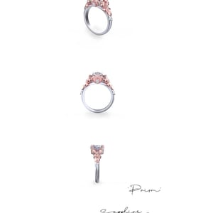 Puede incluir: Un anillo de compromiso de plata y oro rosa con una piedra central grande y transparente y piedras m&aacute;s peque&ntilde;as en la banda. El anillo est&aacute; engastado con un dise&ntilde;o floral y las palabras 'Prism' y 'Sapphire Studies Design' est&aacute;n escritas debajo del anillo.
