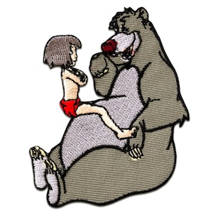 May include: An embroidered patch featuring a cartoon image of Mowgli from Disney's Jungle Book sitting on Baloo the bear. Mowgli is wearing a red loincloth and Baloo is brown with a red nose.