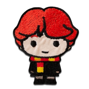 May include: Embroidered patch featuring a cartoon character with red hair, a black robe, and a red and yellow scarf. The character has a smiling face and is standing with their arms at their sides.