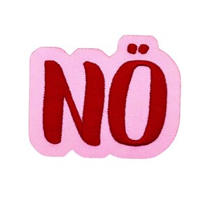 May include: A pink embroidered patch with the word "NO" in red, featuring a unique design. The patch has a light pink background and a textured appearance, suitable for clothing or accessories.