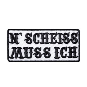 May include: White embroidered patch with black text that reads "N' SCHEISS MUSS ICH"