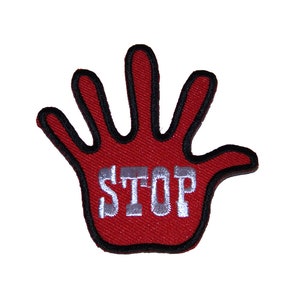 May include: Red embroidered patch with a hand shape and the word "STOP" in white lettering.