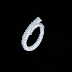 May include: White embroidered letter O on a black background.