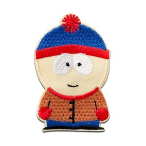 Pode incluir: Patch bordado com um personagem de desenho animado com chapéu azul, detalhes vermelhos e jaqueta marrom. O personagem tem olhos brancos grandes, um pequeno sorriso e luvas vermelhas. O patch é projetado para ser passado a ferro ou costurado no tecido.