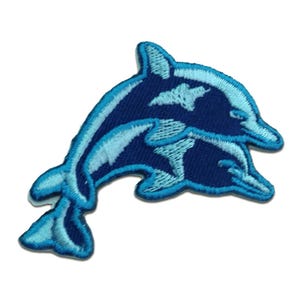 May include: Embroidered patch featuring two dolphins in shades of blue. The design showcases a larger dolphin with a smaller one beneath, both leaping. The patch has a detailed, textured appearance, with a light blue outline.