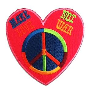 May include: Red heart-shaped patch with a peace sign in the centre. The peace sign is made of blue, green, orange, and red thread. The words "Make Love Not War" are embroidered around the peace sign.