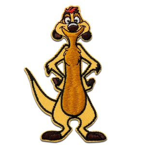 May include: Embroidered patch featuring Timon from The Lion King. The patch depicts Timon in a standing pose with his arms crossed. The patch is primarily yellow and brown with black accents and a red tuft of hair.