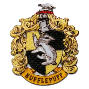 May include: A yellow and black embroidered patch with a badger and the words "Hufflepuff" in a gold banner.