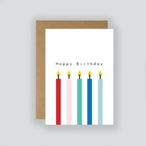 May include: Happy Birthday card featuring a colourful illustration of six candles with flames. The candles are red, pink, teal, blue, light blue, and white.