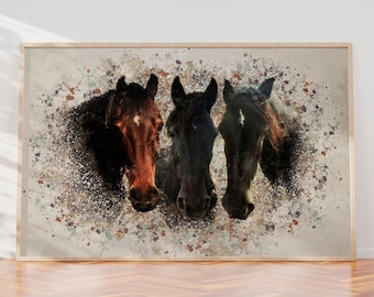May include: Three horse heads are shown in a close-up, with a brown horse on the left, a black horse in the center, and a black horse with a brown mane on the right. The horses are set against a background of white and brown paint splatters.