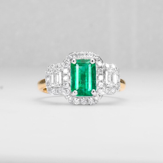 Elongated Colombian Emerald Three-Stone Halo Ring in Platinum and Gold