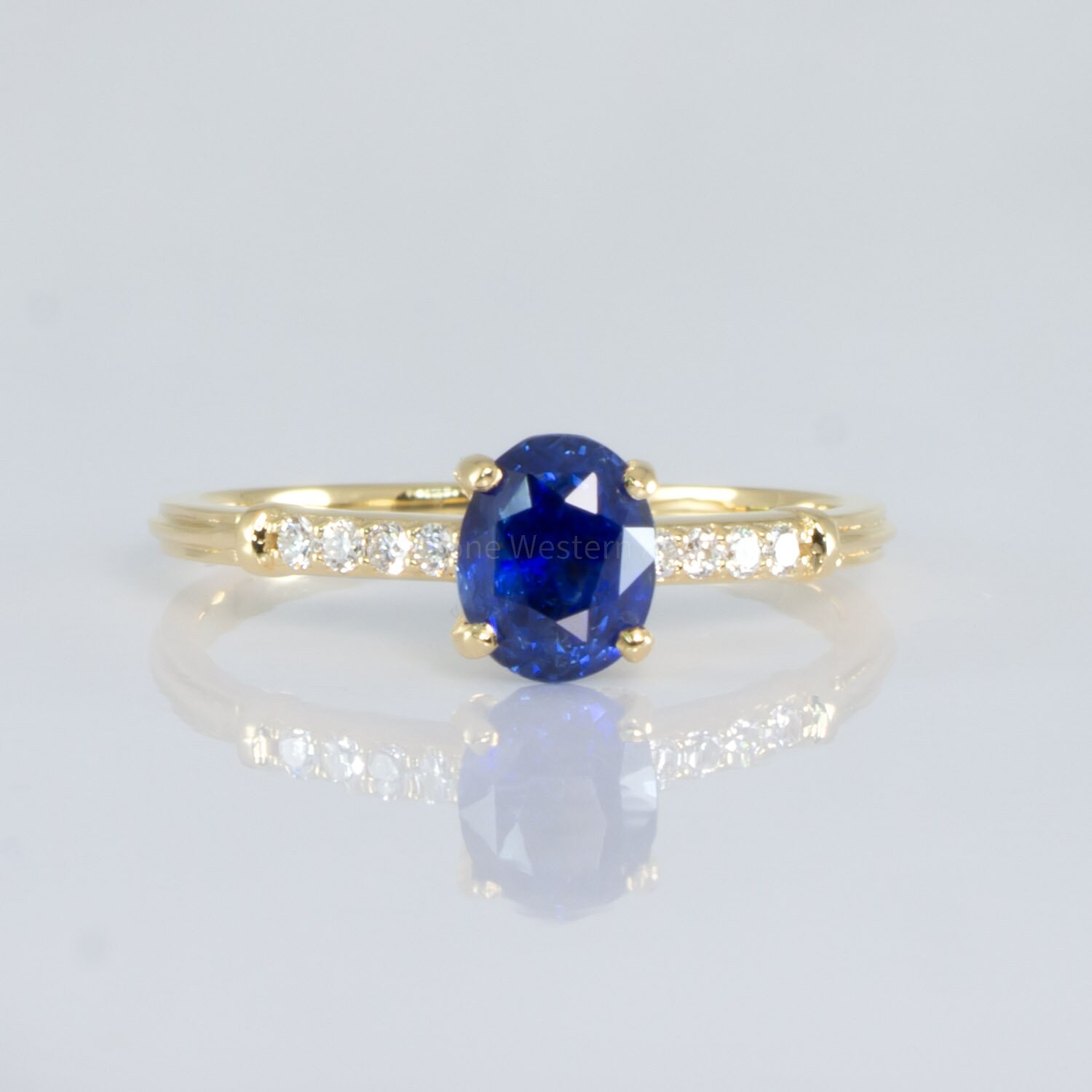 Spiral Diamond and Blue Sapphire Engagement Ring