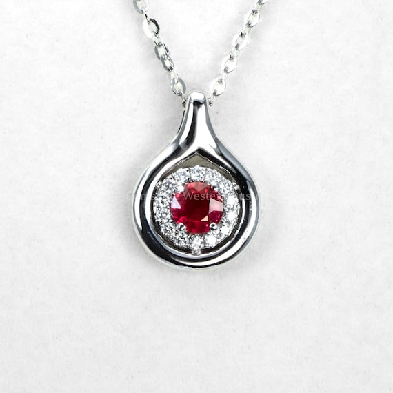 Round Ruby and Diamond Halo Pendant in White Gold