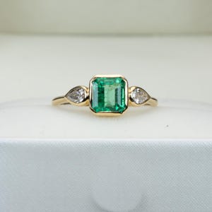 Colombian Emerald Engagement Ring in 18K Yellow Gold with Pear Shape Diamonds