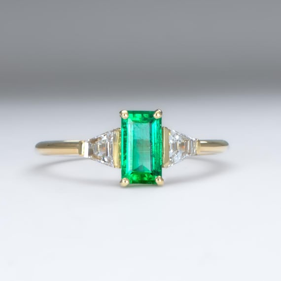 Elongated Emerald Cut Ring with Colombian Emerald and Trapezoid Diamonds in 18K Yellow Gold