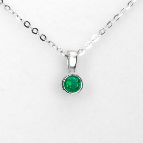 Round Emerald Solitaire Pendant in Platinum with Vivid Green 0.18ct Stone