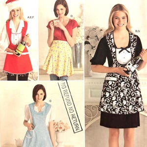May include: A sewing pattern for four different aprons. The aprons are in various styles and colors, including a red apron with white trim, a yellow apron with floral print, a blue and white gingham apron, and a black and white apron with a floral print. The pattern is from Simplicity and includes the number 2298.