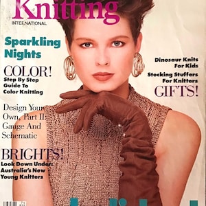 May include: Vogue Knitting magazine cover featuring a woman wearing a brown knitted sweater and brown leather gloves. The cover text reads "Sparkling Nights", "Color! Step By Step Guide To Color Knitting", "Design Your Own, Part II Gauge And Schematic", "BRIGHTS! Look Down Under Australia's New Young Knitters", and "holiday!"