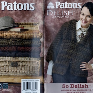 May include: A brown and tan knitted cardigan with a cowl neck and long sleeves. The cardigan is made with a textured yarn and has a button fastening. The text "Patons Delish™" is printed on the front of the cardigan.