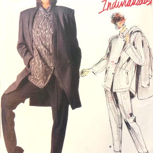 May include: Vogue Patterns Individualist sewing pattern for a jacket and pants by Issey Miyake. The pattern is number 1664. The image shows two models wearing the pattern. One model is wearing a black jacket and pants, and the other model is wearing a white and gray striped jacket and pants.