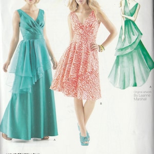 May include: A sewing pattern for a dress with two different styles. The first style is a long, teal dress with a layered skirt. The second style is a shorter, coral dress with a printed pattern. The pattern is called "#1752".