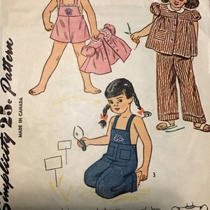 May include: Vintage Simplicity sewing pattern 1687, size 4, for children's clothing. The pattern includes a pink dress with a floral design, a striped pyjama set, and dungarees. The pattern is made in Canada.