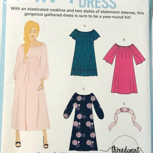 May include: A sewing pattern for a 4-in-1 gathered dress. The pattern includes illustrations of four dress styles, including a pink dress with long sleeves and a teal dress with short sleeves. The text reads "Sizes S-XL".