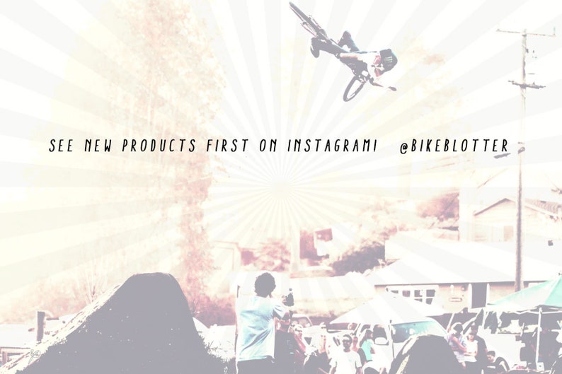 May include: A person on a bicycle performs a trick in the air, with a blurred background of a crowd and buildings. The text "SEE NEW PRODUCTS FIRST ON INSTAGRAMI @BIKEBLOTTER" is visible at the top of the image.