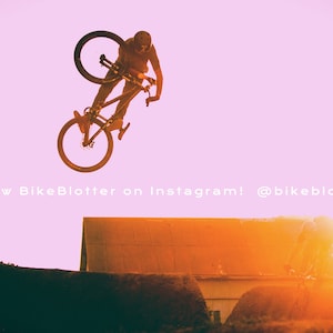 May include: A person performs a bike trick in the air, silhouetted against a pink and orange sunset. The bike is black and has a black seat. The person is wearing a black helmet and black clothing. The text "Follow BikeBlotter on Instagram! @bikeblotter" is visible at the bottom of the image.
