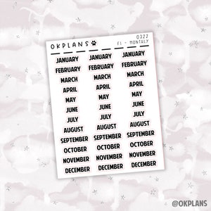 May include: A set of 36 monthly planner stickers with the months of the year printed in black text on a white background. The stickers are outlined in pink.