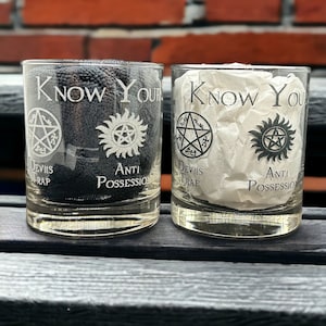 May include: Two clear glass tumblers with the words "Know Your" and the symbols for "Devil's Trap" and "Anti-Possession" etched on them.