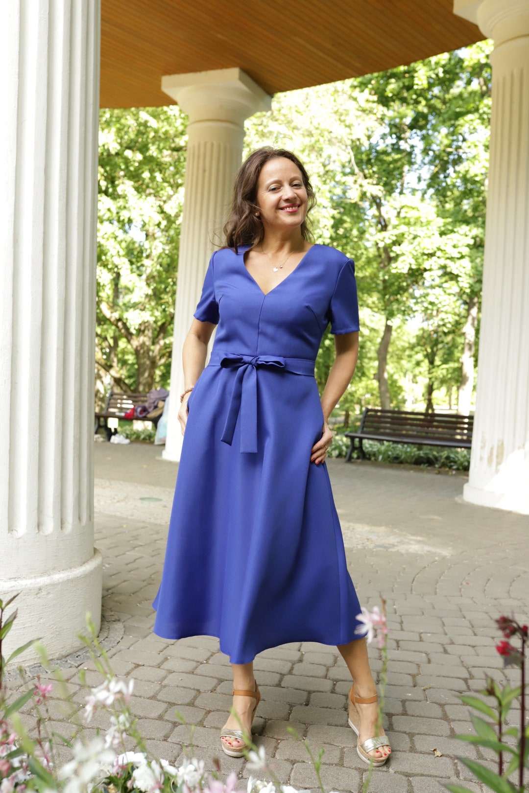 women's summer dress blue royal colors below the knee with pockets, short sleeve. elegant, retro style women's summer dress blue royal colors below the knee with pockets, short sleeve. elegant, retro style