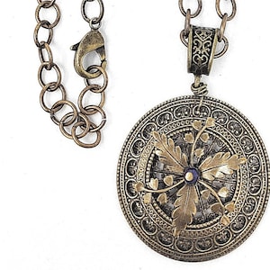Beautiful Brass Oval Link Chain accented with a unique Filigree Pendant.