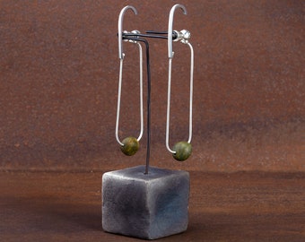 Opposite J _single or pair womens  earrings_sterling silver stud climber with silver chain and a dangling beach pebble_by Ariadni Kypri