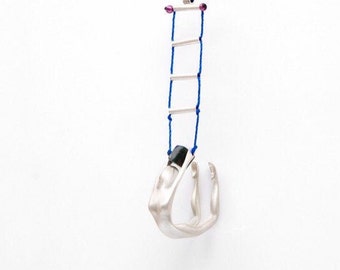 Nicole (or Nicolås) on rope ladder, by Ariadni Kypri, necklace, silver statement necklace, acrobats_CircuS Collection