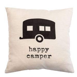 May include: A square, off-white pillow with a black graphic of a camper and the words "happy camper" printed below. The camper has two square windows and one rectangular window. The pillow has a textured appearance.