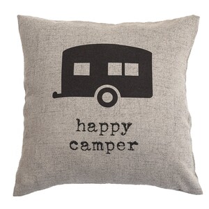May include: A square, gray decorative pillow with a black camper graphic and the words "happy camper" printed below. The pillow has a textured appearance, suitable for home decor.