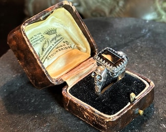Ring in the Night — the smoky quartz with two skull outriders
