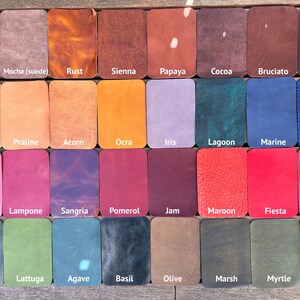 May include: A grid of thirty-two rectangular leather swatches in various colors and textures. Each swatch is labeled with its color name, including Terra, Mocha, Rust, Sienna, Papaya, Cocoa, Bruciato, T. Moro, Moccasin, Praline, Acorn, Ocra, Iris, Lagoon, Marine, Cobalt, Cipria, Lampone, Sangria, Pomerol, Jam, Maroon, Fiesta, Bordo, Foresta, Lattuga, Agave, Basil, Olive, Marsh, Myrtle, and Nero.