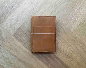 Cover with front pocket and simple pockets inside for all size notebook