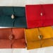 HandStitchedLeatherT store logo