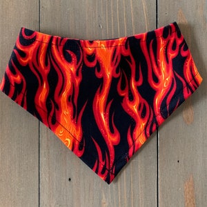 May include: A black bandana with a red and orange flame pattern.