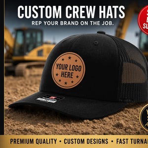 May include: A black baseball cap with a mesh back and a circular tan leather patch on the front. The patch features the text "YOUR LOGO HERE" surrounded by small stars. The cap has a flat brim with a small rectangular sticker on the top surface.